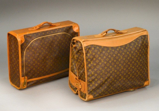 Two Louis Vuitton Suitcases: Soft sided cases with leather trim, comprising a suicase and a folding suit carrier. Case, Height 7 1/2 inches, width 18 inches, depth 22 inches.