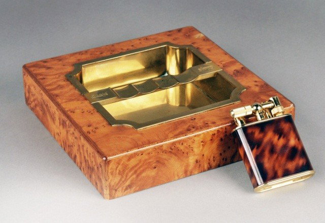 Davidoff Wood and Brass Ashtray: Together with a Royal Queen table lighter. Ashtray height 1 3/4 inches, 8 inches, square.