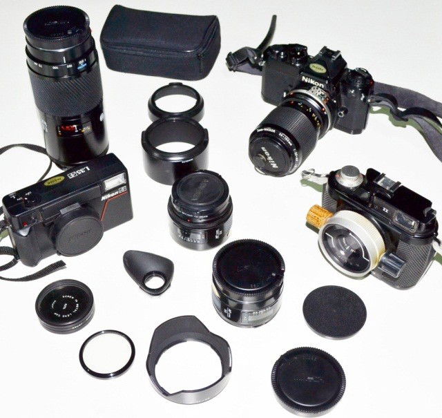 Miscellaneous Group of Cameras: Nikon film cameras, including the Nikonos II, and various lenses by different makers, etc