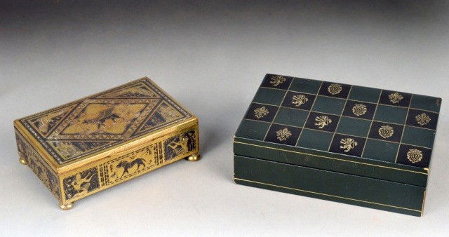 Two Decorative Boxes: One a patinated metal wood lined box with Egyptian motif, and the other an Italian leather clad card box. Leather box height 2 inches, width 6 1/4 inches, depth 4 1/2 inches.