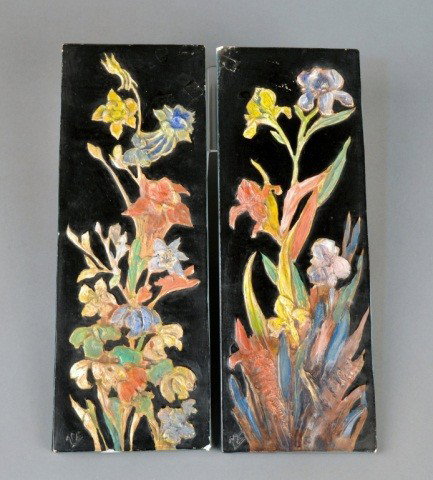 Pair of Plaster Plaques: Hand painted floral decoration on a black ground. 15 1/4 x 5 1/2 inches.