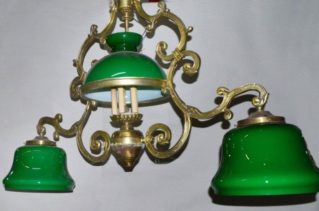 Three Light Hanging Fixture: Brass with three green shades. Height 36 inches, width 60 inches. Note: Removed from the Steinway Mansion