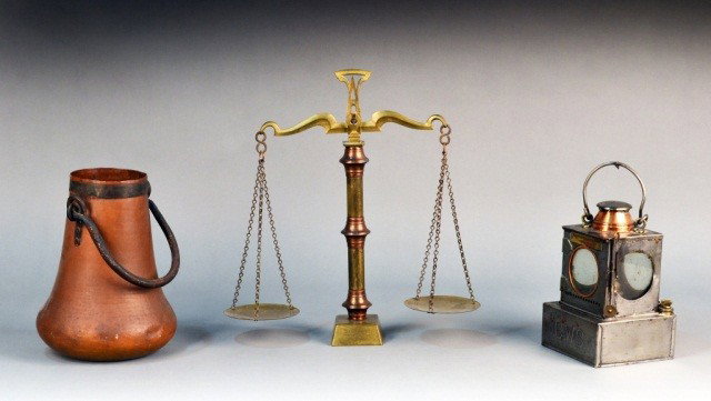Miscellaneous Group of Metal Decorations: Comprising a brass balance scale, a copper handled bucket and a metal oil lantern. Scale height 16 1/2 inches.