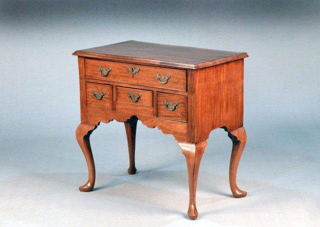 Queen Anne English Mahogany Lowboy: 18th century, rectangular top with molded edge, above a long drawer and three short drawers, raised on cabriole legs with slipper feet. Height 31 inches, width 33 inches, depth 20 1/2 inches.
