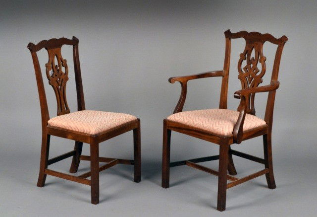 Set of Ten George III Style Mahogany Dining Chairs: Two armchairs and eight side chairs, each with a rectangular back with outset corners, a ribbon back splat, trapezoidal slip seat and square chamfered legs joined by a H stretcher. Height 37 inches, w