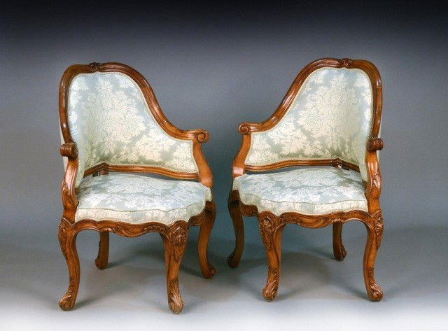 Pair of Louis XV Style Chairs: Greek damask upholstered carved walnut corner chairs. Height 38 inches, width 31 inches, depth 26 inches.