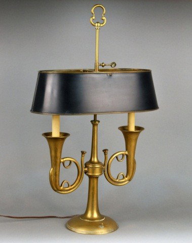 Brass Bouillotte Lamp: Two horn shaped arms issuing lights, tole shade. Height 28 inches.