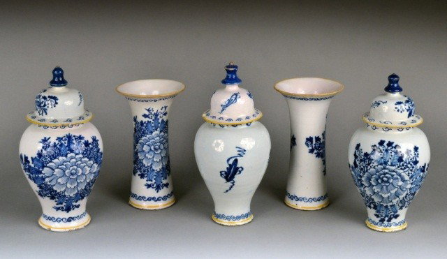 Delft Blue and White Porcelain Garniture: Comprising three covered jars and two vases, floral decoration. Height 11 1/2 inches.