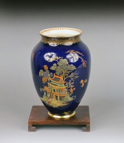English Carlton Ware Porcelain Vase: With raised gilt and enamel chinoiserie decoration on a cobalt blue ground. Height 11 1/2 inches.