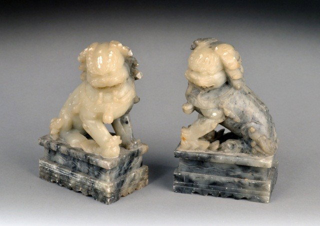 Pair of Soapstone Foo Lions: Each seated with one front paw raised. Height 6 inches.