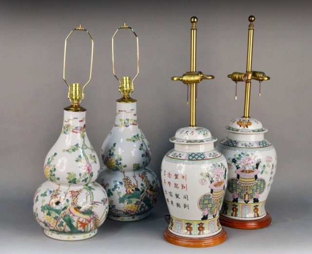 Two Pairs of Asian Porcelain Lamps: One, a pair of Chinese porcelain rose medallion double gourd form lamps, height 29 inches; the other, a pair of two light lamps, each in the form of a covered ginger jar. Height 31 inches.