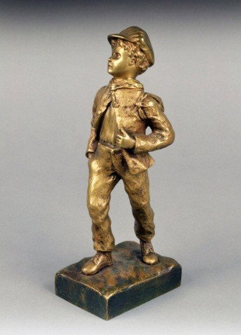 Bronze Figure of a Boy: Modelled standing and holding a sack on his left shoulder. Height 10 inches.