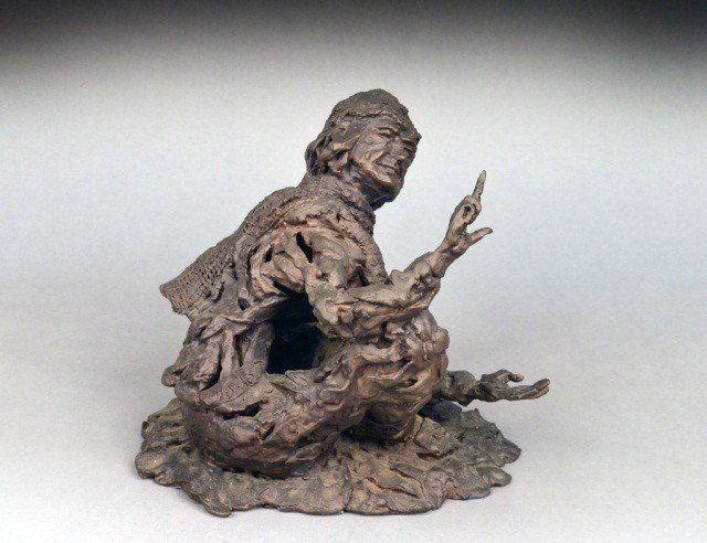 Contemporary Sculpture Seated Man: Modeled in seated position, leaning and pointing upwards with his left hand. Height 11 inches.