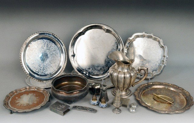 Miscellaneous Group of Silver Articles: Including a sterling silver water pitcher, sterling silver shaker, English footed salver, footed center bowl, five circular trays, assorted silver plated decorative table articles. Pitcher height 9 in