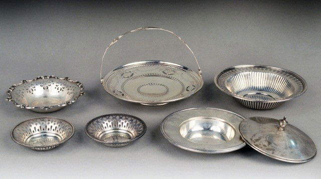 Miscellaneous Group of Sterling Silver Articles: Comprising a swing handle basket, candy dish with reticulated border, wine bottle coaster, Towle bonbon dish, pair of Mauser nut dishes and a cover. Basket diameter 7 inches, total approximately 17 ou