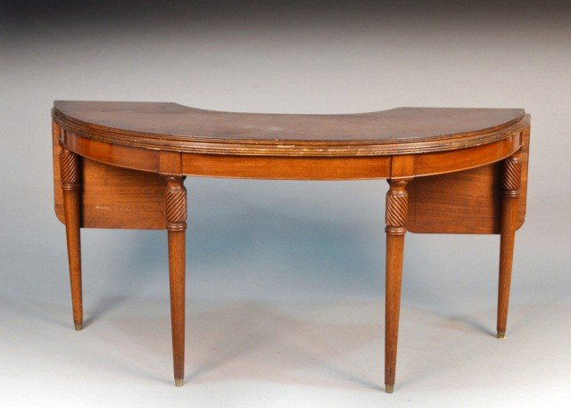 George III Style Mahogany Hunt Table: Of typical form, top with reeded edge, on tapered legs. Height 29 1/2 inches, width 58 1/2 inches, depth 22 inches.