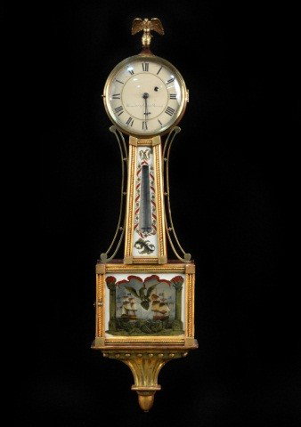 American Eglomise Banjo Clock: Circa 1820, works by Lemuel Curtis and J.L. Dunning, with scenes depicting the war of 1812 and a rare thermometer in the throat. Height 40 inches.