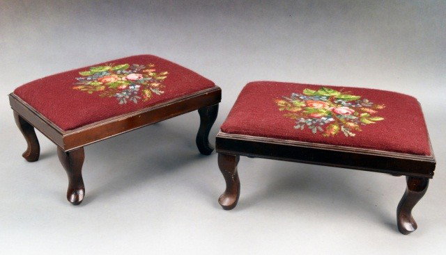 Two Footstools: Rectangular, with needlework upholstery, cabriole legs. Height 9 inches, width17 inches, depth12 inches.