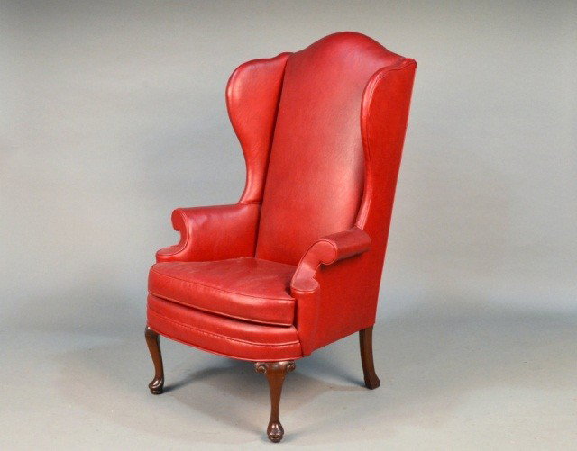Wing Chair & Two Footstools: Queen Anne style red simulated leather upholstered wing chair. Height 50 inches, width 30 inches, depth 33 inches.