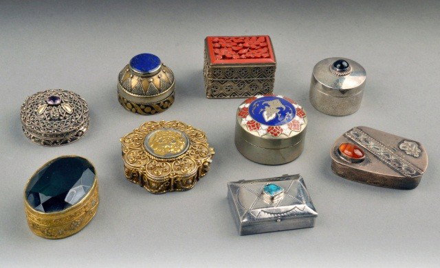 Nine Trinket Boxes: Various styles including a Mexican sterling silver box, a Siamese enamel decorated box, an Asian cinnabar inset box, an Israeli box with carnelian cabochon, and Italian box with green stone, etc.