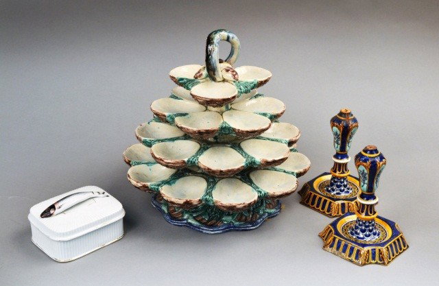 Majolica Shell Fish Stand: Four graduated tiers of shell form dishes, height 12 inches; together with a porcelain sardine dish and a pair of majolica candlesticks (as is condition).