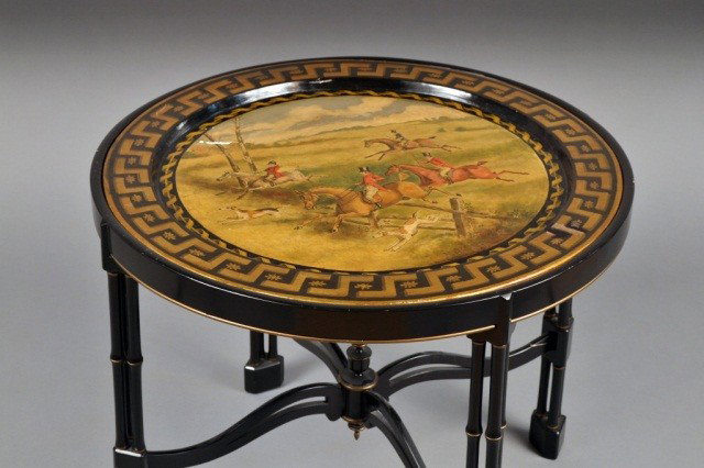 Regency Style Tole Tray Table: Circular tole tray painted with a hunt scene, on a black painted faux bamboo stand. Height 20 inches, diameter 24 inches.