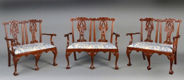 Three Chippendale Style Chair Back Settee's: Each a mahogany double chair back open arm settee, with upholstered slip seat and cabriole legs ending in ball and claw feet. Height 41 inches, width 45 inches, depth 24 inches.