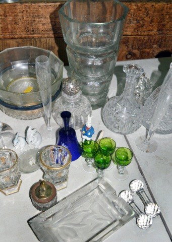 Miscellaneous Group of Glass Table Decorations: Including a stoppered decanter, three vases, two bowls, rectangular dish, Mary Gregory style cobalt bell, set of four green glass cordials, sterling topped cut glass dresser bottle, carafe, porcelain 