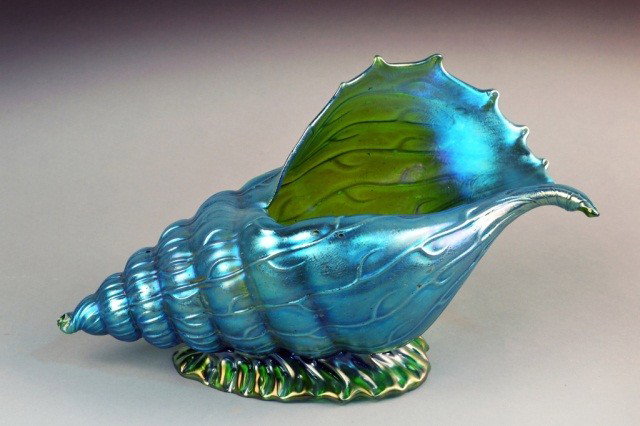 Lotz Art Glass Vase: Shell form blue iridescent glass vase. Height 8 inches, length 14 inches.