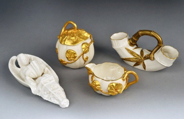 Royal Worcester and Belleek Porcelain Articles: Comprising a Royal Worcester porcelain cream and sugar set and a bamboo vase; together with a Belleek wall pocket. Vase height 4 inches.