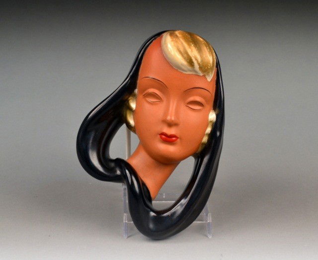 Art Deco Pottery Wall Face: Blond woman wearing a black scarf. Height 9 inches.