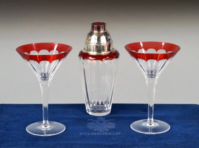 Faberge Crystal Cocktail Suite: Cut glass cocktail shaker, with two stemmed cocktail glasses en suite, in original fitted Faberge box. Cocktail glass height 7 inches.