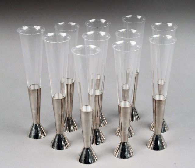Set of Eleven Christofle Champagne Flutes: Silver plate and glass. Height 8 1/4 inches.