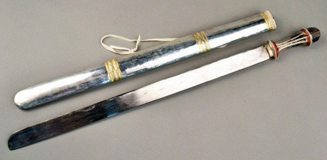 Northwestern Indian Long Broad Sword: Silvered hilt and scabbard with decorative gold mounts, chain link handle and Damascian Blade. Blade length 26 inches.