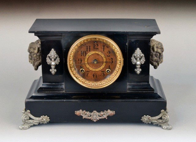 Ansonia Mantel Clock: Architectural style case with scroll and bison decoration. Height 10 1/2 inches.
