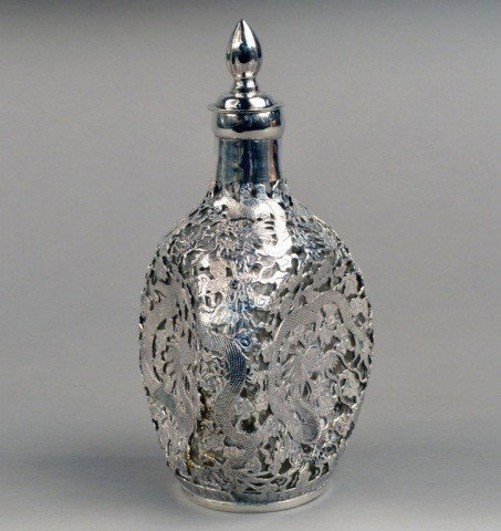 Chinese Export Silver Overlay Decanter: Allover decoration of flowers and dragons. Height 10 inches.