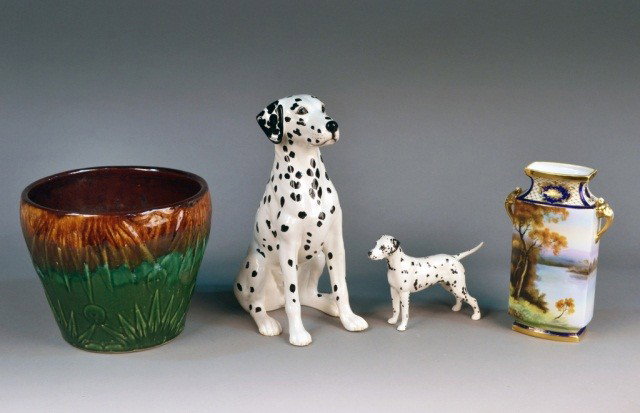 Four Ceramic Table Articles: Comprising two porcelain figures of Dalmatians, a Japanese porcelain vase and a ceramic glazed jardiniere. Tallest height 14 inches.