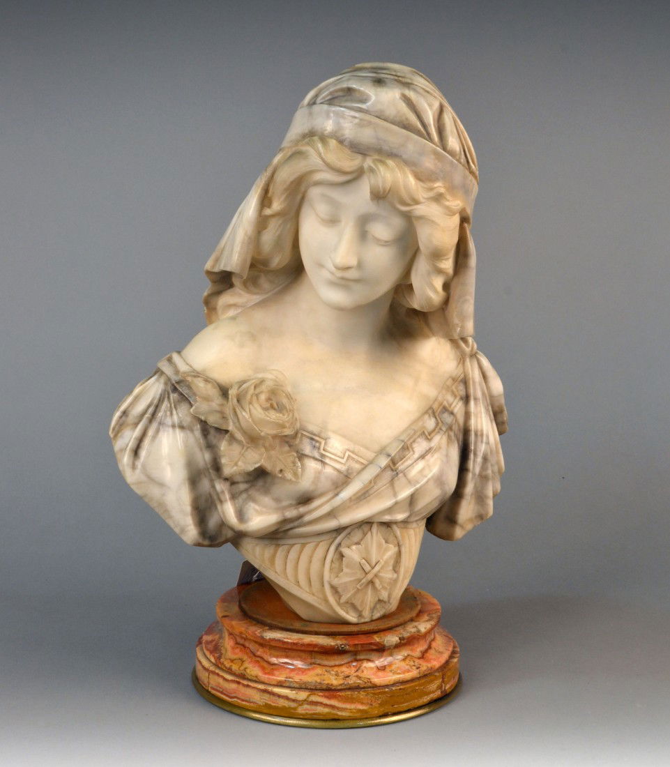 A. Cipriani (It. Act. 1875-1925) Bust of a Woman: Marble, a young woman facing to her right, wearing a head scarf, a rose on her shoulder, on a socle base. Bust height 19 inches.