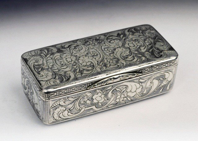 Imperial Russian Silver and Niello Snuff Box: Circa 1846, maker's mark HM, rectangular with scroll decoration and gilt interior. Height 1 inch, width 3 inches, depth1 3/4 inches, approximately 2.5 ounces.