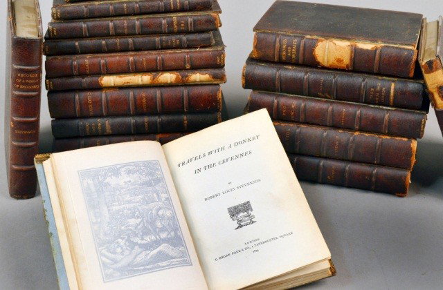 Robert Louis Stevenson Assorted Works: Group of approximately forty- four volumes of first editions and early Stevensonia in matching contemporary full brown morocco gilt by Thomas Best bindings. Including thirty- two of Stevenson's novels