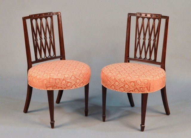 Pair of Hepplewhite Style Mahogany Side Chairs: Early 19th century, with X form pierced splats, balloon seats, tapered square front legs and splayed rear legs. Height 34 inches, width 20 inches, depth 18 inches.