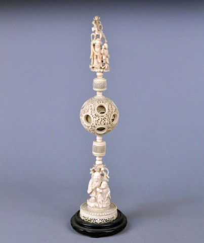 Chinese Carved Ivory Puzzle Ball: On a carved wood base. Height 18 inches.