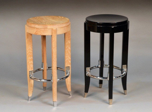 Two Mid Century Modern Bar Stools: One ebonized, the other bleached oak. Height 26 inches, diameter 14 1/2 inches.