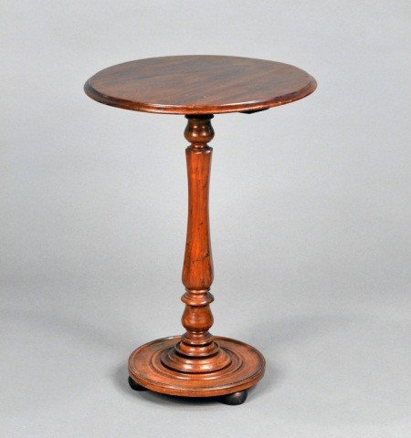 William IV Kettle Stand: 19th century, with singular molded center support raised on three bun feet. Height 28 inches, diameter 20 inches.