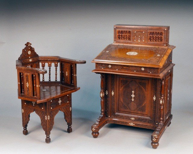 Syrian Davenport Style Desk and Chair: Carved hardwood with mother of pearl inlay, slant front lift top, fitted interior. Height 42 inches, width 26 inches, depth 24 inches; together with a matching armchair.
