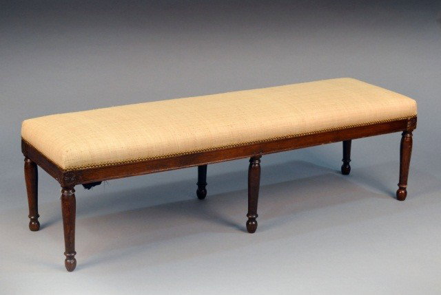 French Directoire Beech Bench: Early 19th century, raffia upholstery atop turned legs. Height 18 1/2 inches, width 60 inches, depth 17 1/2 inches.