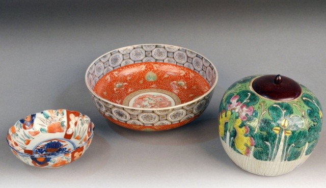 Three Asian Porcelain Articles: Comprising a Japanese Imari Bowl, a Chinese porcelain center bowl, and a Famille Verte covered ginger jar. Center bowl height 4 1/2 inches, diameter 12 1/4 inches.
