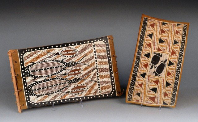 Two African Painted Panels: One, Milingimbi with geometric symbols, by artist Yuwati, depicting some major totems of his clan, 15 x 8 inches; the other, Cameroon depicting the Dum Dum water beetle, signed M01 WWAI, 17 1/2 x 10 i