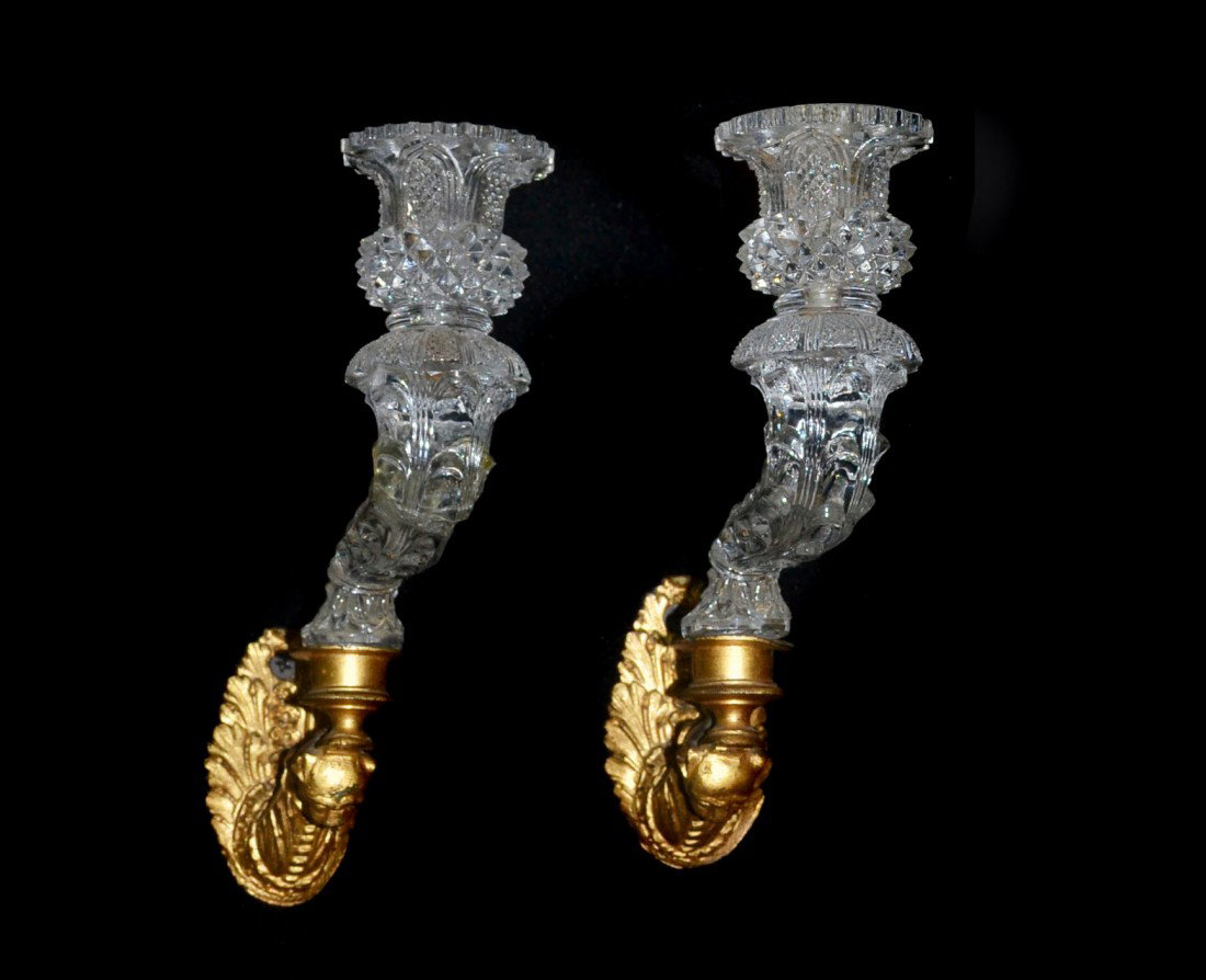 Pair of Cut Crystal and Gilded Metal Sconces: Single light, with an animal form arm. Height 8 inches.