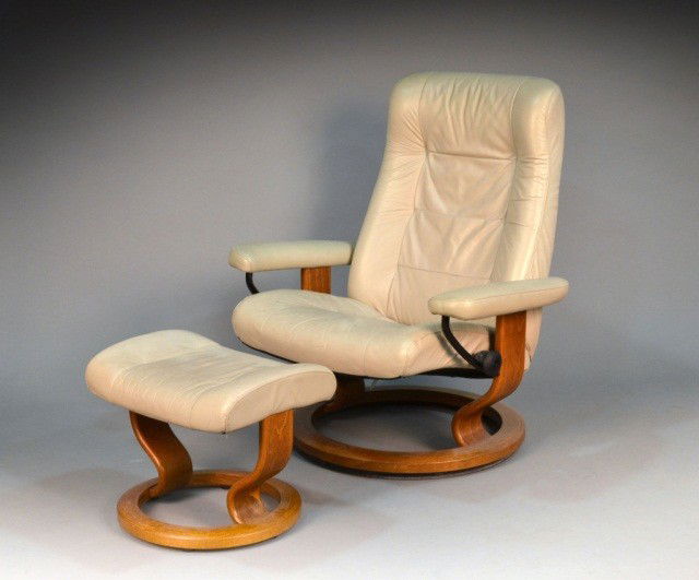 Ekornes Leather Recliner Chair and Ottoman: Beige leather upholstery. Chair, height 38 inches, width 34 inches, depth 35 inches.